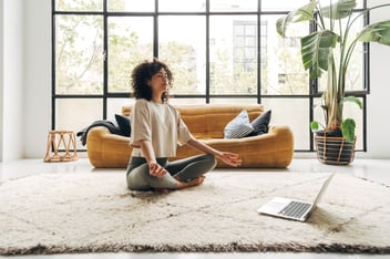 Woman meditating during busy day